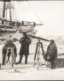 Shutter shape of shots from arctic expedition, on black cover, THE NANSEN PHOTOGRAPHS, in white font below.