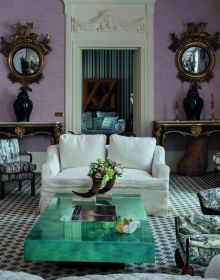 Luxury interior with patterned rug, gold mirrors, cream furnishings, carved statue, on cover of 'Lorenzo Castillo', by Ediciones El Viso.