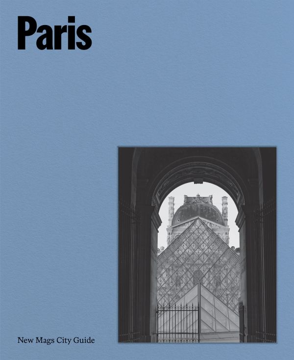 Book cover of Paris; featuring Parisian architecture through an archway. Published by Helmin & Sorgenfri.