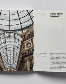 Book cover of Milan; featuring a large, arched stone gate. Published by Helmin & Sorgenfri.