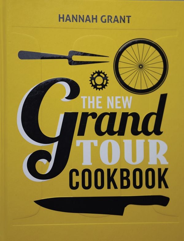 Book cover of The New Grand Tour Cookbook 2; featuring a knife and a bike wheel. Published by Helmin & Sorgenfri.