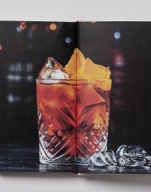 Book cover of Vermouth: A Classic Revival; featuring a cocktail, with an olive on a stick. Published by Helmin & Sorgenfri.