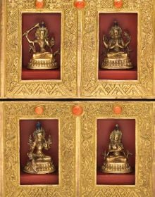 Tibetan Shrine Room with Buddhas and decorated chests, Assembly of the Exalted in gold font above