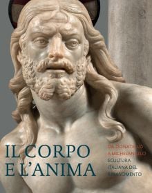 Intricately carved sculpture of bearded man with flowing hair looking to his left, Il Corpo e l’Anima in dark blue font in lower left corner.