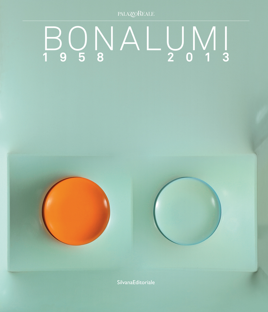 Book cover of Agostino Bonalumi: 1958-2013, with an aerial view of two bowls: one orange and one blue. Published by Silvana.