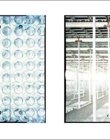 Photo of skeletal inside of cigarette factory during its construction with eerie shafts of light beaming through