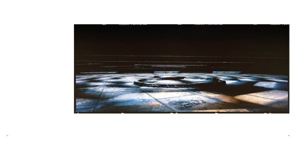 Aerial view of geometrical top of Gasometro, Carlo Valsecchi Gasometro M.A.N. n. 3 in dark grey font above