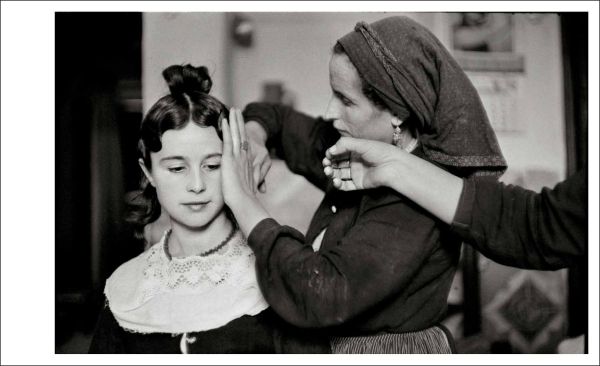 Book cover of Inge Morath; featuring a self portrait photograph of the photographer holding camera. Published by Silvana.