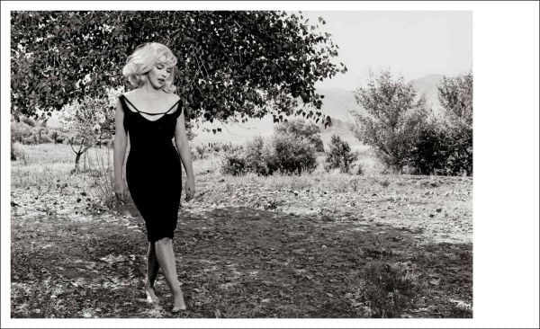 Book cover of Inge Morath; featuring a self portrait photograph of the photographer holding camera. Published by Silvana.