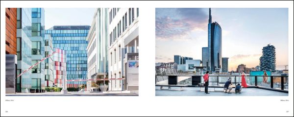 Urban landscape with road, train track, high rise buildings and machine cranes, FRANCESCO RADINO fotographie/photographs 1968-2018 in green font above.