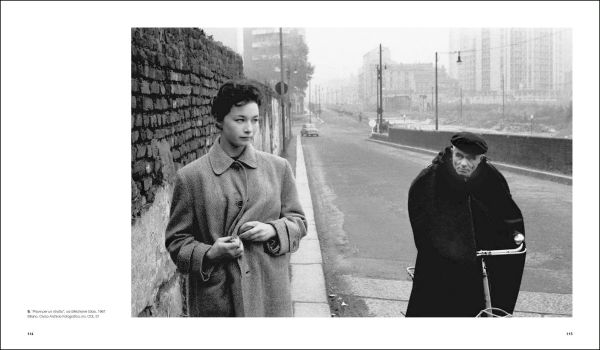 Shot of wet brick roads of Milan in rain, surrounded by buildings, CESARE COLOMBO Fotographie Photographs 1952-2012 in yellow and white font to centre right.