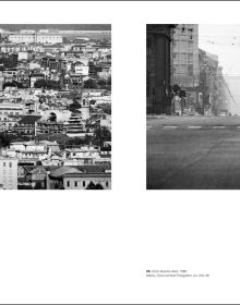 Shot of wet brick roads of Milan in rain, surrounded by buildings, CESARE COLOMBO Fotographie Photographs 1952-2012 in yellow and white font to centre right.