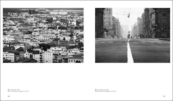 Shot of wet brick roads of Milan in rain, surrounded by buildings, CESARE COLOMBO Fotographie Photographs 1952-2012 in yellow and white font to centre right.