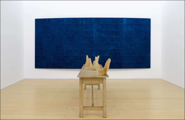 Mangiafuoco, 1979 by Pier Paolo Calzolari, man breathing fire into red canvas, Pier Paolo Calzolari Painting as a Butterfly in white font above.