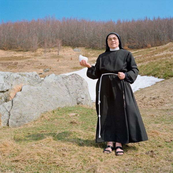 Pea green Fiat 500 with TV on top of roof, green trees behind, white cover, OLIVO BARBIERI EARLY WORKS 1980 1984 in black font above and below.