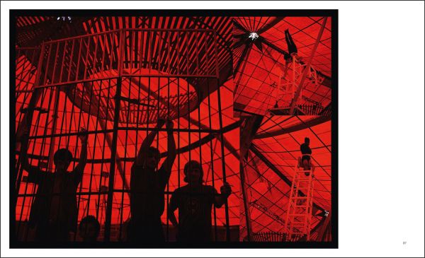 Book cover of Miguel Rio Branco, with a black female resting her hand on pool table, in dark lit room. Published by Silvana.