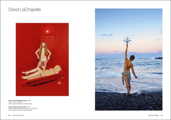 Film still of man, chin deep in water, white building with tower looming over him, True Fictions in white font to upper right.