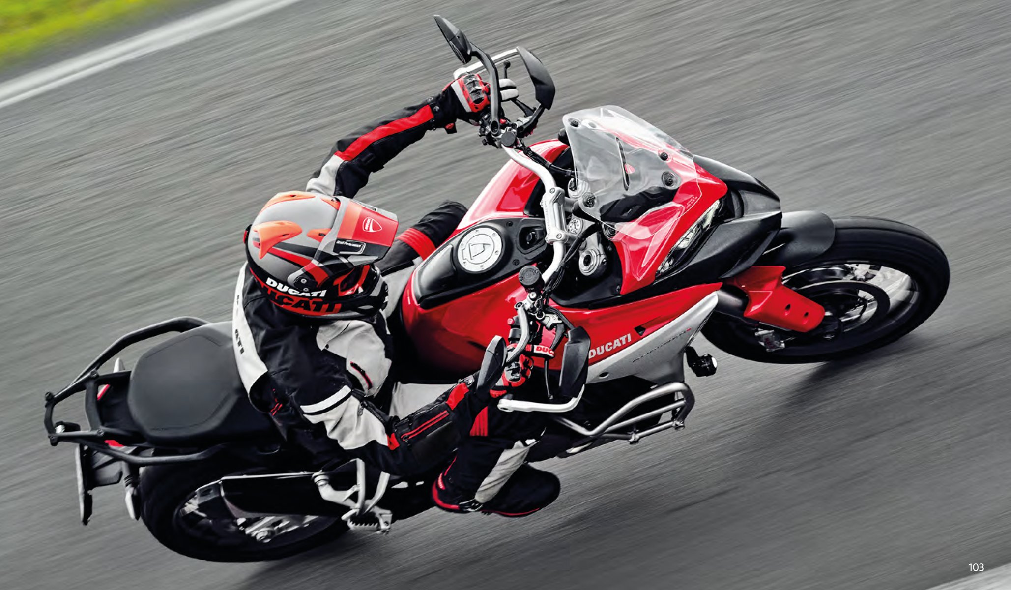 2 Ducati motorcycles travelling on Italian mountain road with Ducati Rule All Roads A Journey across the Italian Beauty on the Multistrada V4 in red and black font above