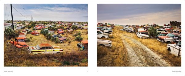 Book cover of Luca Campigotto American Elegy, featuring a blue juggernaut parked between brick buildings on American street. Published by Silvana.