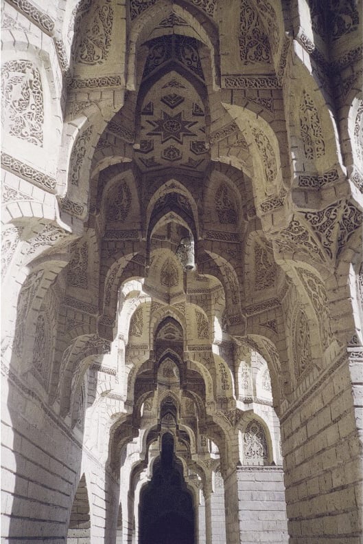 Book cover of Baghdad: Eye’s Delight, featuring a female figure walking near the Freedom Monument in Baghdad, Iraq. Published by Silvana.