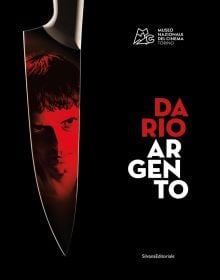 Book cover of Dario Argento: The Exhibition, with portrait of the Italian film director reflected in sharp knife, Published by Silvana.