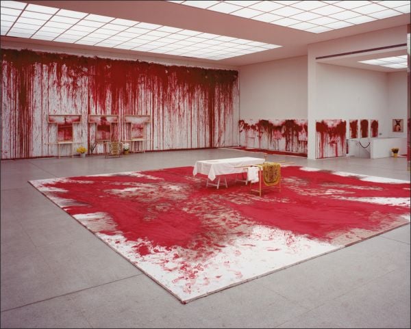 Book cover of Hermann Nitsch, featuring the artist's red paint splattered canvas. Published by Silvana.