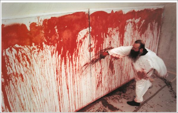 Book cover of Hermann Nitsch, featuring the artist's red paint splattered canvas. Published by Silvana.