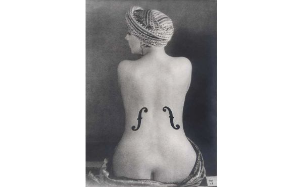 Book cover of Man Ray, 1870-1976. Master of Lights, with a surrealist female portrait. Published by Silvana.