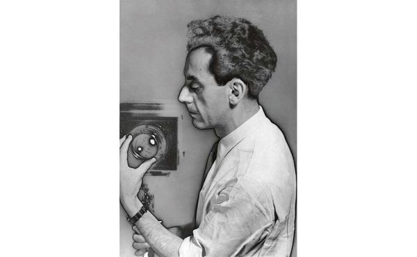 Book cover of Man Ray, 1870-1976. Master of Lights, with a surrealist female portrait. Published by Silvana.