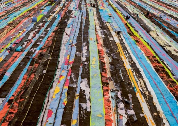 Book cover of Mark Bradford: Keep Walking, with a man walking away from viewer. Published by Silvana.