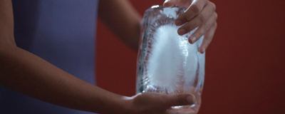 Book cover of Argentina: What the Night Tells the Day, with a figure holding what looks like a block of ice. Published by Silvana.