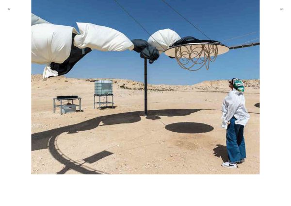 Book cover of Olafur Eliasson: The Curious Desert, with the desert floor seen through an optical device. Published by Silvana.