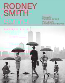 Book cover of Rodney Smith: Photography Between Real and Surreal; featuring five figures holding umbrellas, looking out across the water at New York skyline, with their backs to the viewer. Published by Silvana.