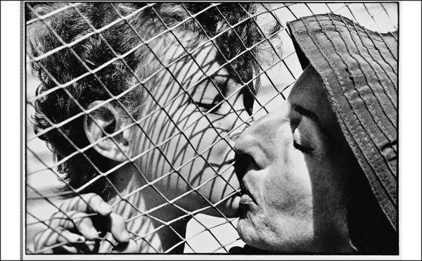 Book cover of Federico Garolla: Fotografie/Photographs 1948-1968, with a photograph of white sheets hanging in the street. Published by Silvana.