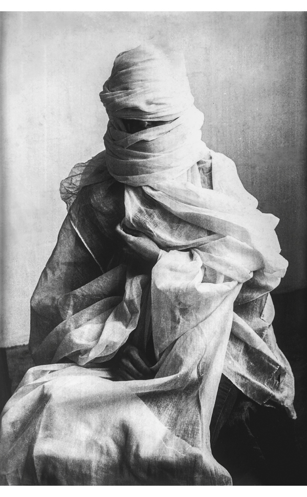 Book cover of Manzar: Art and Architecture from Pakistan 1940s to Today, featuring a painting of figure in red robes and turban-style head dress. Published by Silvana.