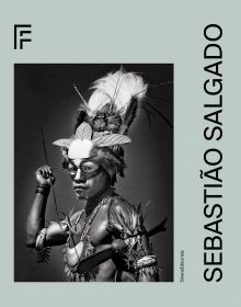 Book cover of Sebastião Salgado featuring a tribesman in traditional dress and face paint. Published by Silvana.