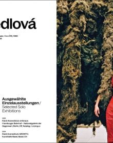 Book cover of Klára Hosnedlová: embrace; featuring a large installation with figures laying on floor surrounded by material sculptures. Published by Silvana.