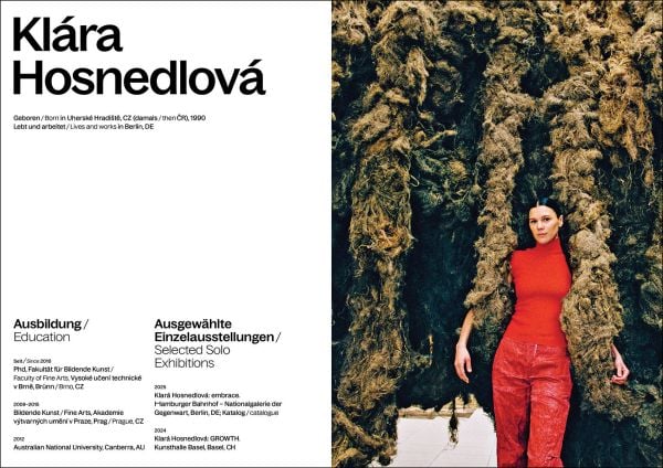 Book cover of Klára Hosnedlová: embrace; featuring a large installation with figures laying on floor surrounded by material sculptures. Published by Silvana.
