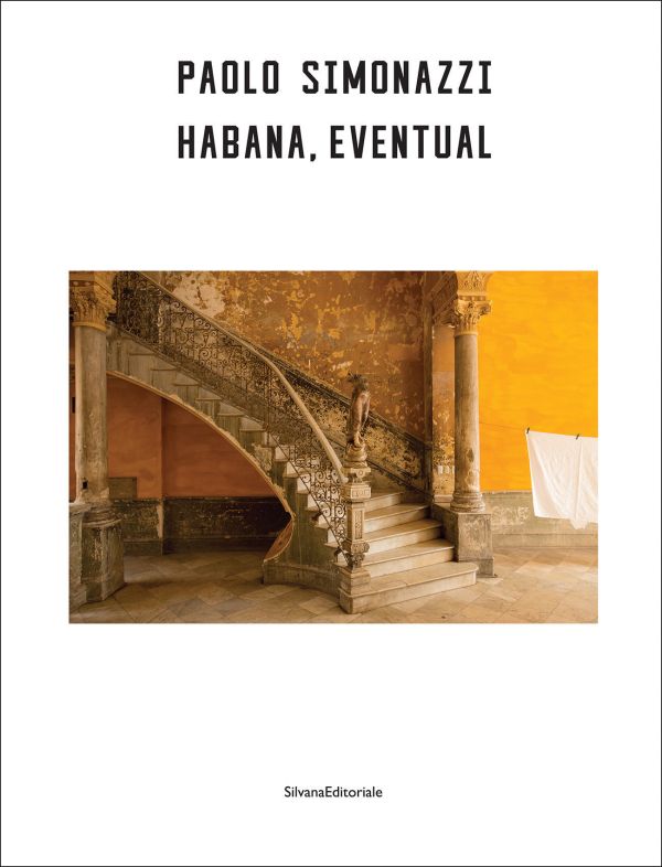 Book cover of Paolo Simonazzi: Habana, Eventual; featuring a photograph of an ornate stone staircase set against warm yellow walls. Published by Silvana.