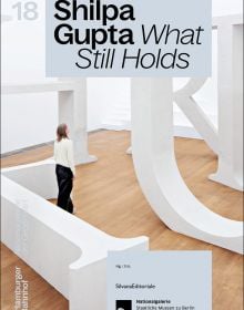 Book cover of Shilpa Gupta: What Still Holds; featuring a person standing among an installation of large white letters. Published by Silvana.