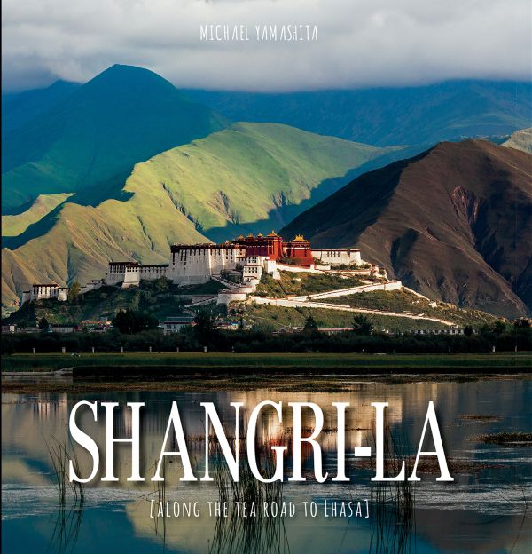 Book cover of Shangri-La, Along the Tea Road to Lhasa, with Lhasa hotel in the mountains. Published by White Star.