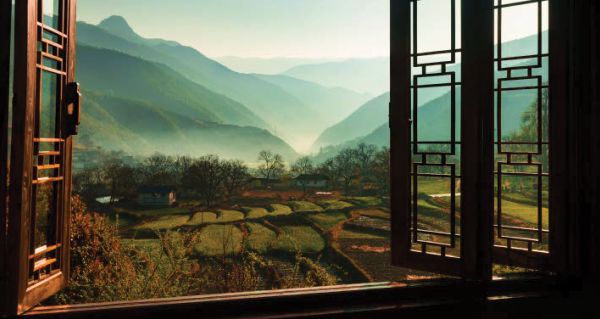 Book cover of Shangri-La, Along the Tea Road to Lhasa, with Lhasa hotel in the mountains. Published by White Star.