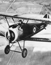 Red German Fokker Triplane and silver Lockheed Martin F-35 Lightning II, on white cover of 'Combat Aircraft, The Legendary Models', by White Star.