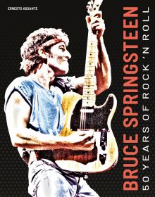 Book cover of Bruce Springsteen, 50 Years of Rock 'n' Roll, with the guitarist on stage at Brendan Byrne Arena, wearing red bandana. Published by White Star.