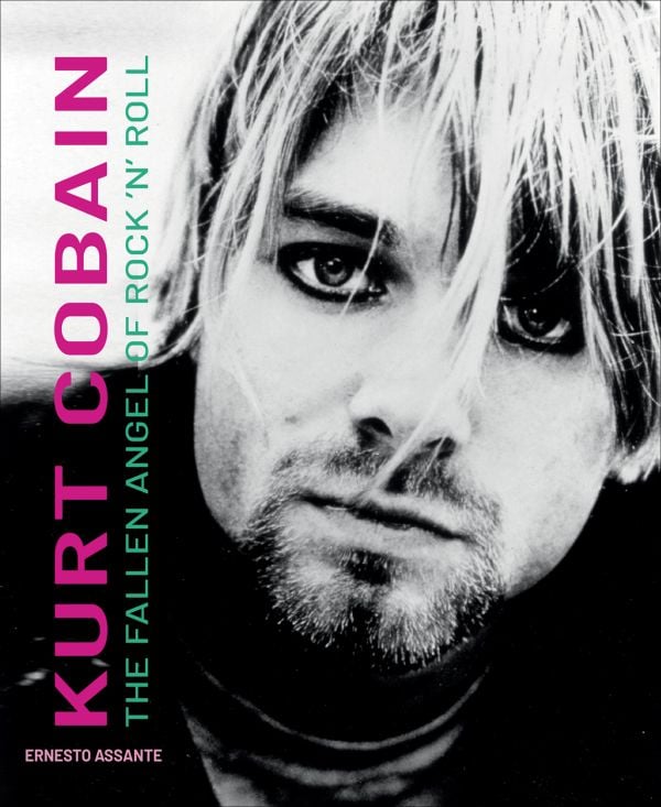 Book cover of Kurt Cobain: The Fallen Angel of Rock 'N' Roll, with an iconic image of the singer wearing thick, black eyeliner, staring into the camera. Published by White Star.