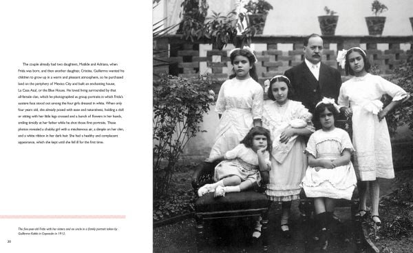 Book cover of Frida:Woman. Artist. Icon.; featuring the artist wearing a large flower in her hair. Published by White Star.