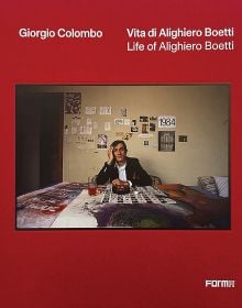 Book cover of Life of Alighiero Boetti, with the Italian artist sitting at a table. Published by Forma Edizioni.