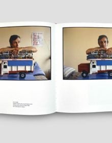 Book cover of Life of Alighiero Boetti, with the Italian artist sitting at a table. Published by Forma Edizioni.