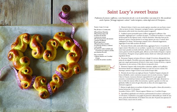 Christmas chocolate roulade, sprinkled with icing sugar, on glass dish, on cover of 'Christmas at Last! Holiday Recipes and Stories from Italy', by Guido Tommasi Editore.
