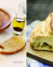 Large round brown top sourdough bread, dusted with flour, on wood board, on cover of 'Sourdough, A Complete Guide and Recipe Book', by Guido Tommasi Editore.